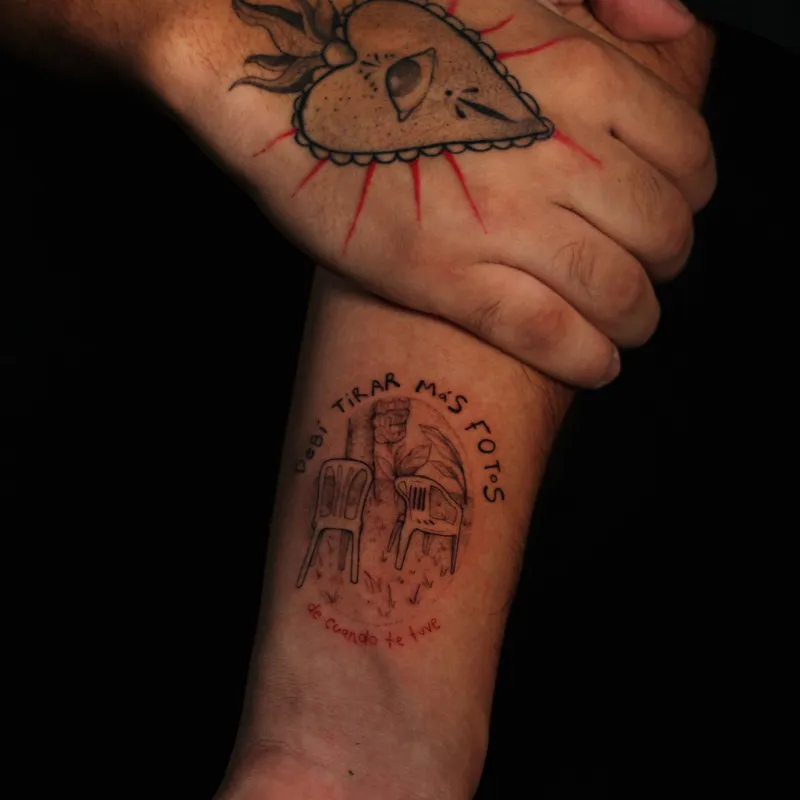 Delicate single-needle botanical blossom on shoulder